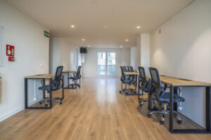 Coworking dentro de la promoción que fomenta las ventajas de vivir cerca del trabajo o la universidad